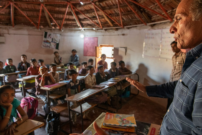 Photo of a teacher speaking to a class in a Ninash Foundation school.