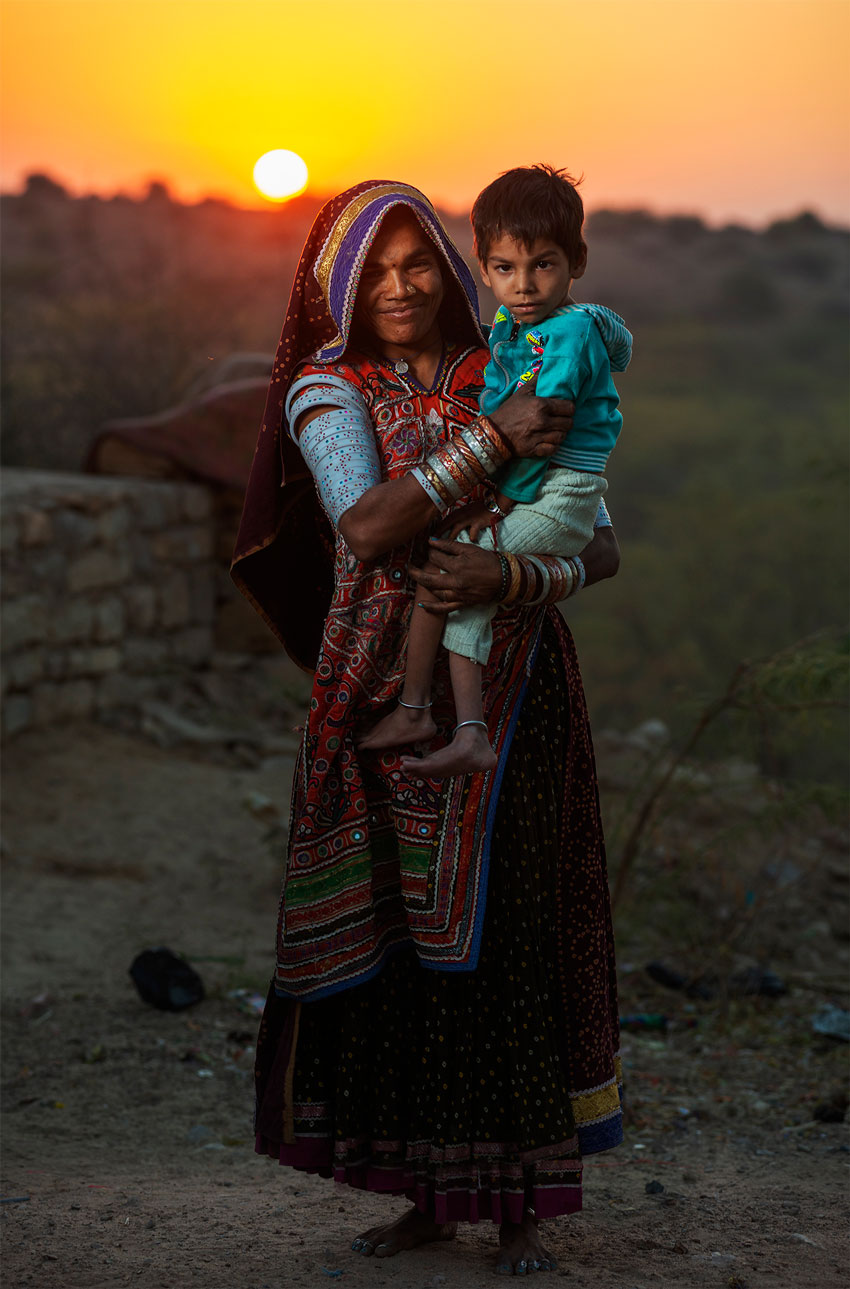 Sean Boggs Ninash Foundation woman with child before the sunset.