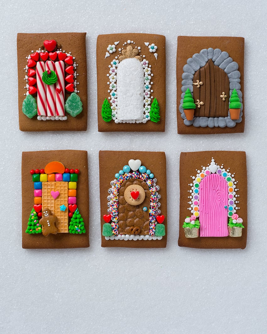 Photo of gingerbread cookies with pictures of doors made from candy for book A Year of Gingerbread Houses by Kristine Samuell.