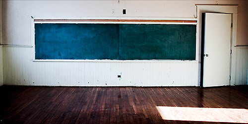 Photo of an old, abandoned classroom by Stan Kaady.