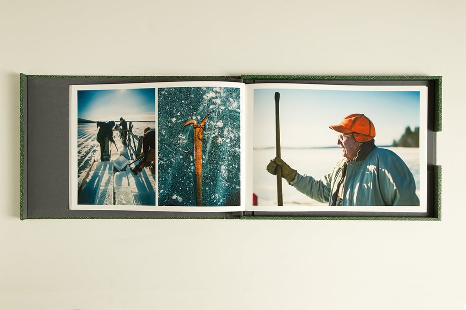 Carl Tremblay's print portfolio open to imagery of hiking in a snowy terrain.