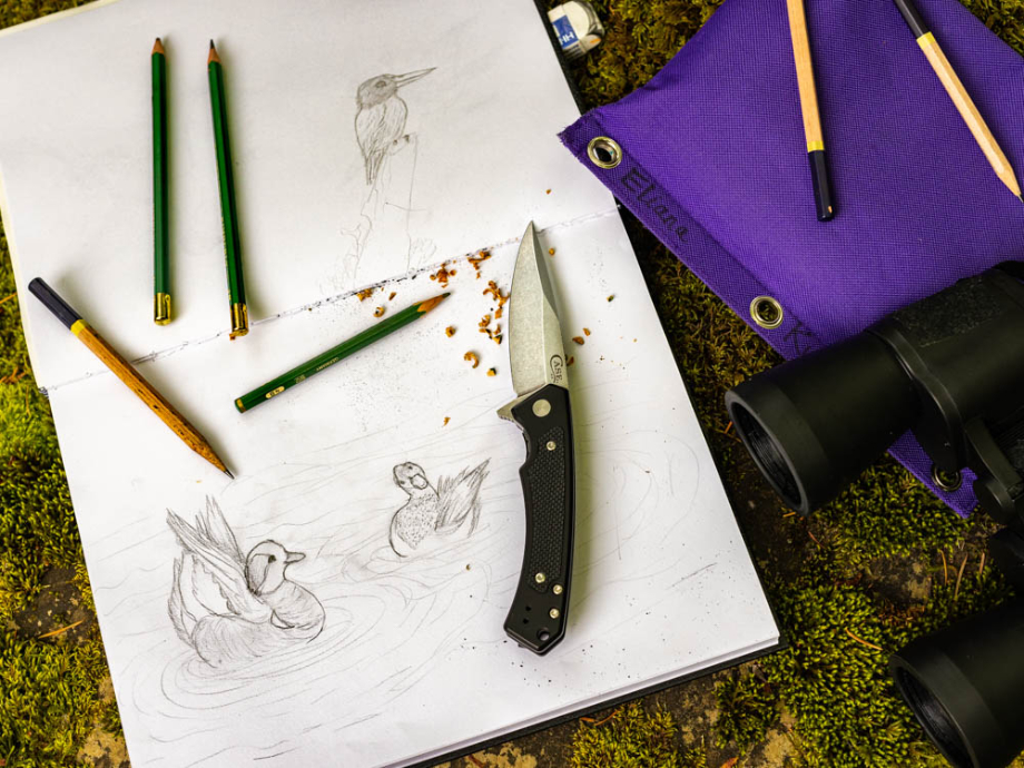 Pencils sharpened by knife on top of mallard drawing shot by Ed Sozhino for Case Knives