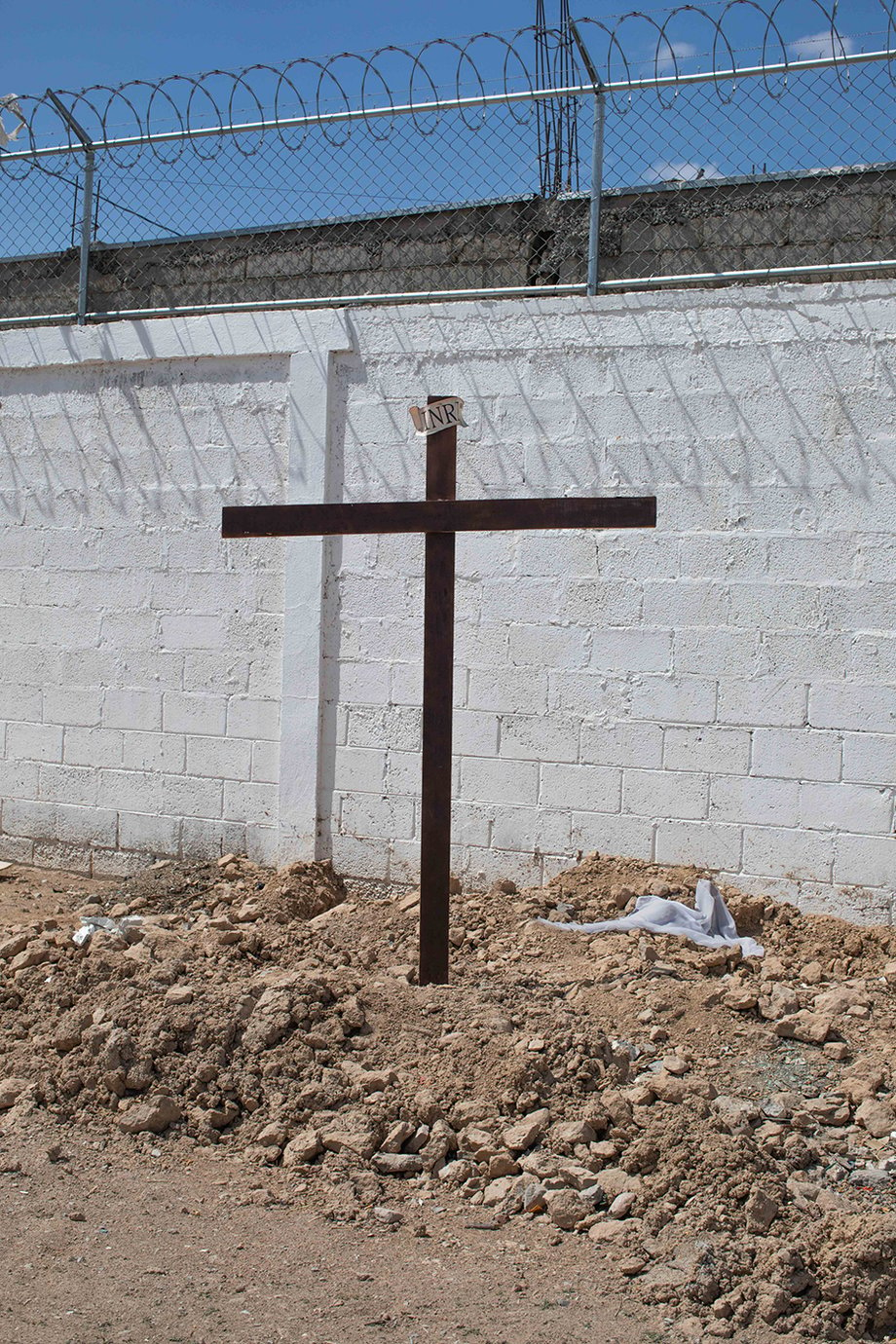 Cross at a local Juarez shelter run by Pastor Hector Trejo shot by Lisette Poole for National Geographic Magazine