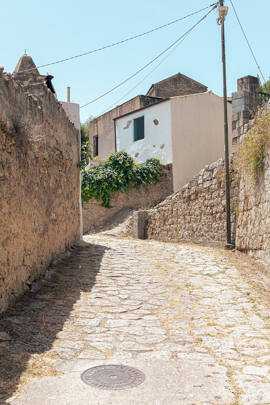 The winding cobblestones streets of Lovelle, Sardinia shot by Alberto Bernasconi for Enjoy magazine