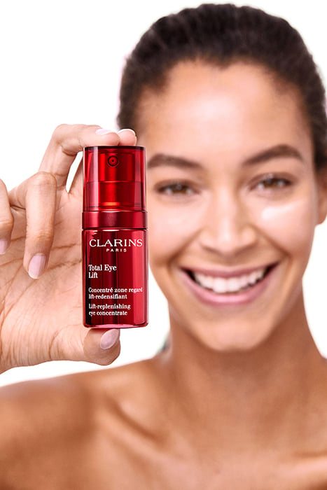 A model showcases Clarins Total Eye Lift Product. Photographed by Andrew Day. 