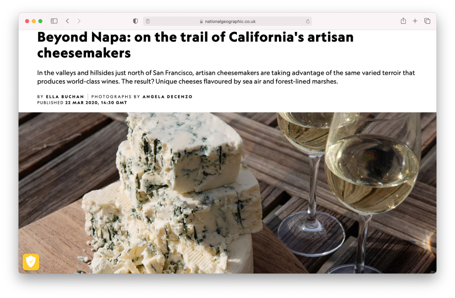 Tear sheet of National Geographic Traveller Food magazine website featuring blue cheese next to white wine shot by Angela DeCenzo