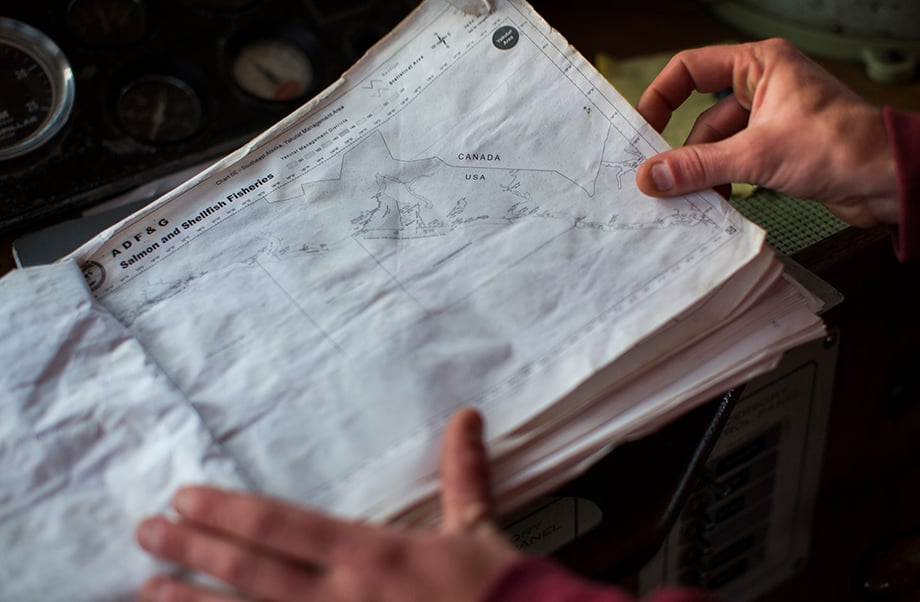 Skipper Hollis Jennings looks at a map. Photographed by Anya Chiblis.