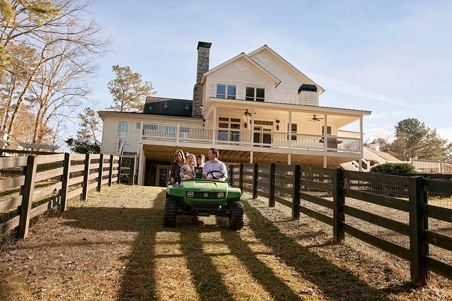 A family on a tractor in the suburbs photographed by Ben Rollins