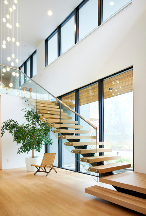 Light coming in on the floating staircase in the Molina house built by GSW Architects shot by Bill Purcell for the Wall Street Journal
