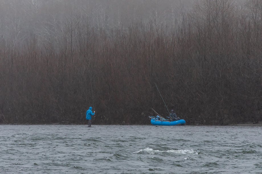 Cameron Karsten captures images of men fishing for wild steelhead during rainy, wet conditions. 