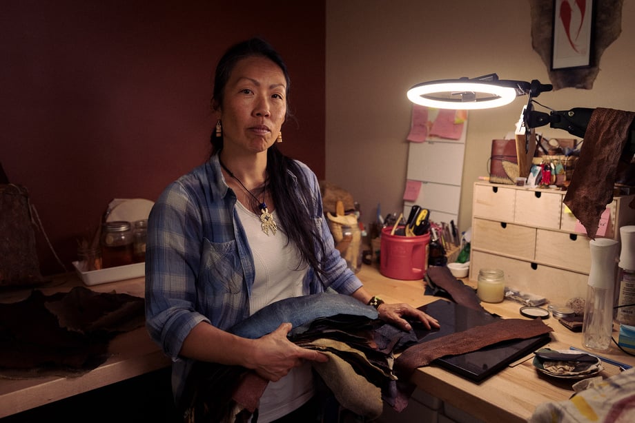 Fish-leather craftswoman Janey at her work table shot by Christian Tisdale for Makers series