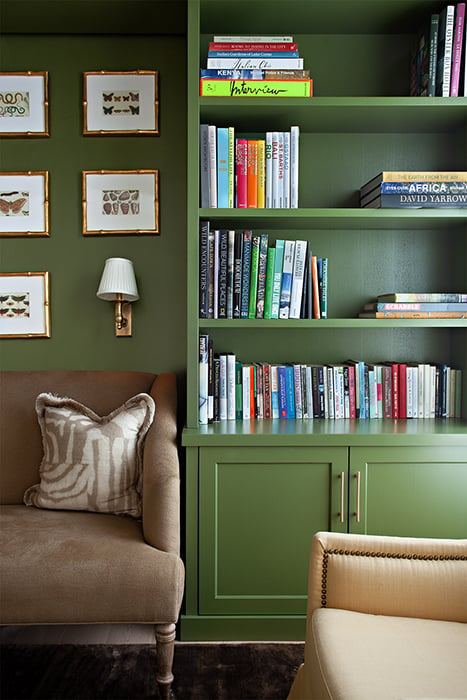 Denice Hough photographs A bright green bookcase adds a pop of color to the room.