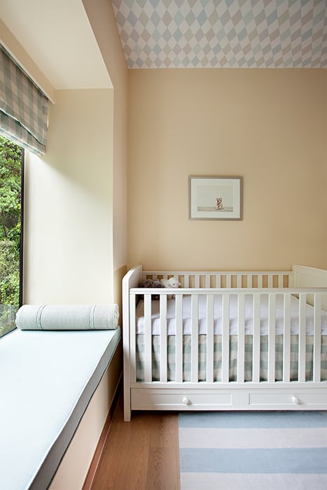 Denice Hough photographs child's bedroom with a crib.