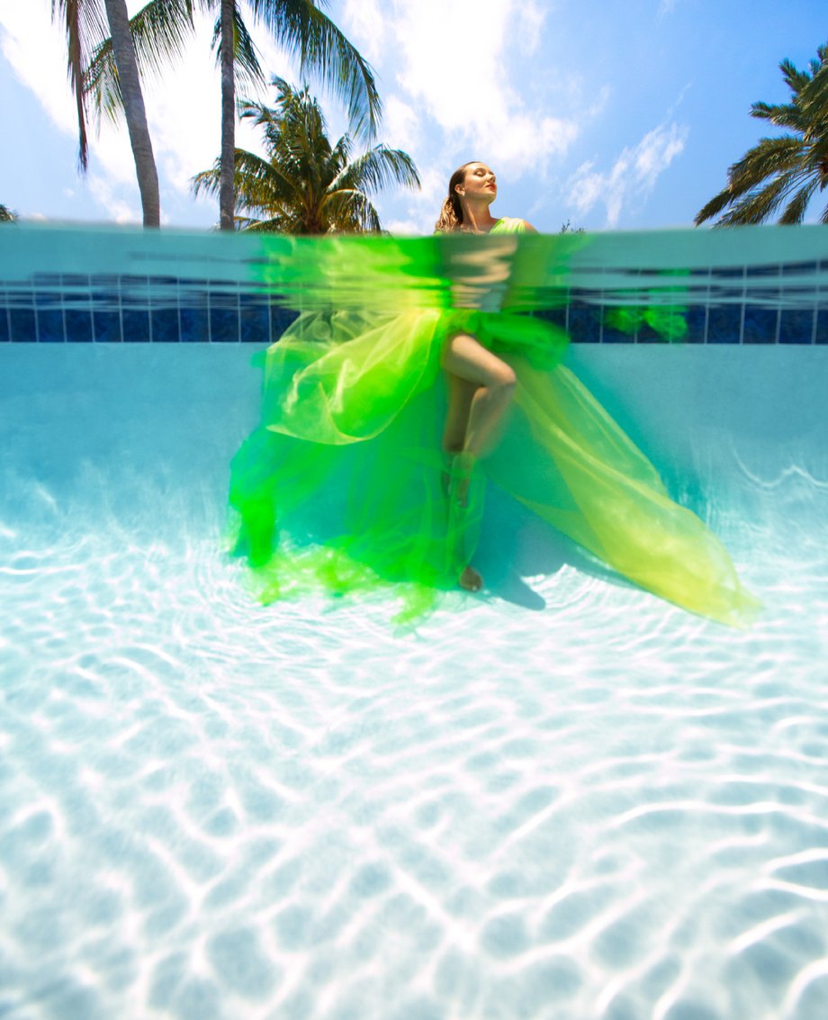 Kristina Makushenko in a flowy green dress shot by George Kamper for Venice magazine