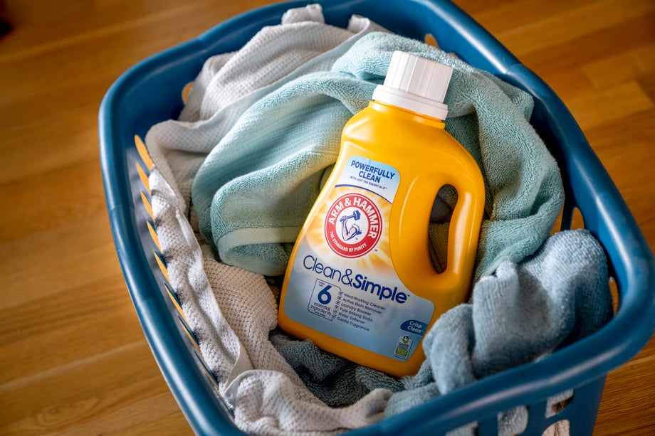 A basket of freshly laundered towels and Arm and Hammer detergent shot by Inti St. Clair