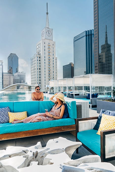 A male and female poolside. Photography by Inti St. Clair for Visit Dallas. 