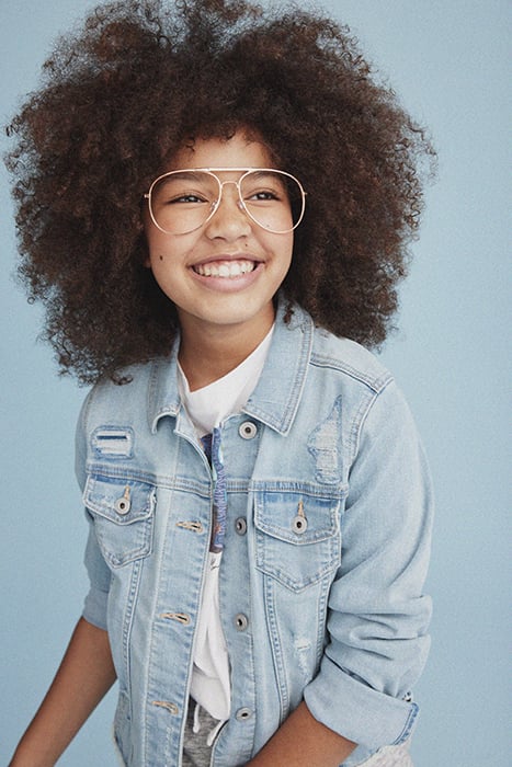 Kid smiling at the camera. Photographed by Janelle Bendycki for Abercrombie Kids. 