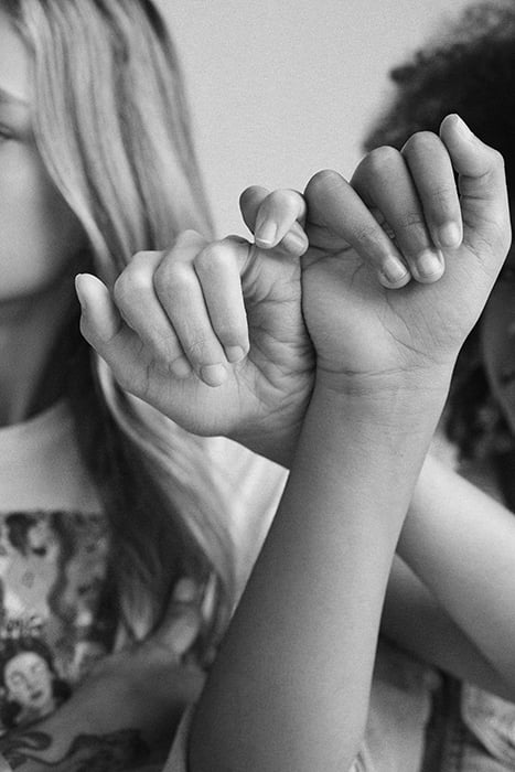 Kids crossing their pinkie fingers. Photographed by Janelle Bendycki for Abercrombie Kids. 