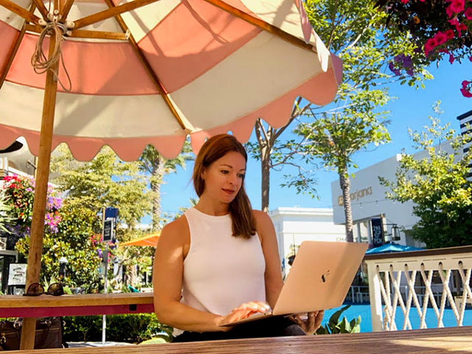 Jen Warren making connections while working remotely from an outdoor café. 