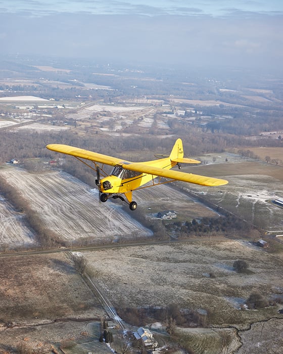Plane in flight. Photography by Jeremy Kramer
