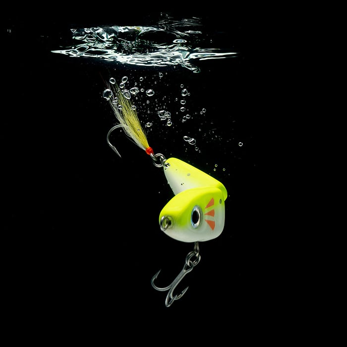 A yellow fishing lure photographed at angle for Scabelly