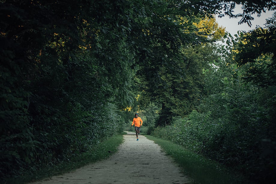 Kevin Serna photographs Coree as he runs through the trails. 