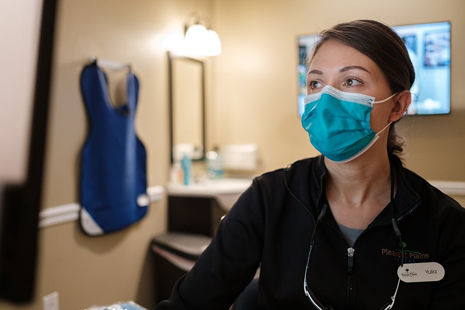 Yulia at Pleasant Plains wears a mask. Photography by Kevin Titus Photo for Light Wave Dental. 