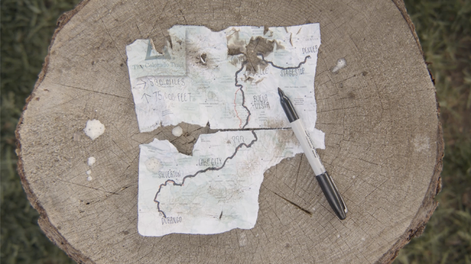Torn and dirty map of the Colorado Trail marked from Denver to Durango from Kody Kohlman's film C-Team shot for Fat Tire