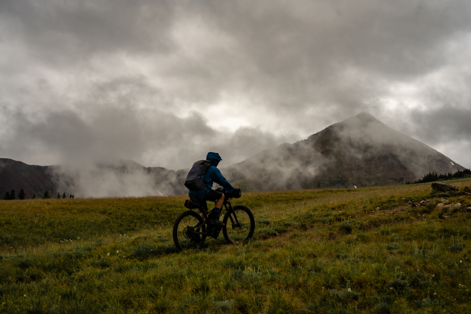 A lone biker travels over a foggy hill from Kody Kohlman's film C-Team shot for Fat Tire