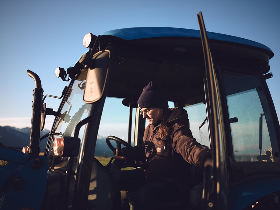 Amy driving a tractor. Photograph by Kody Kohlman