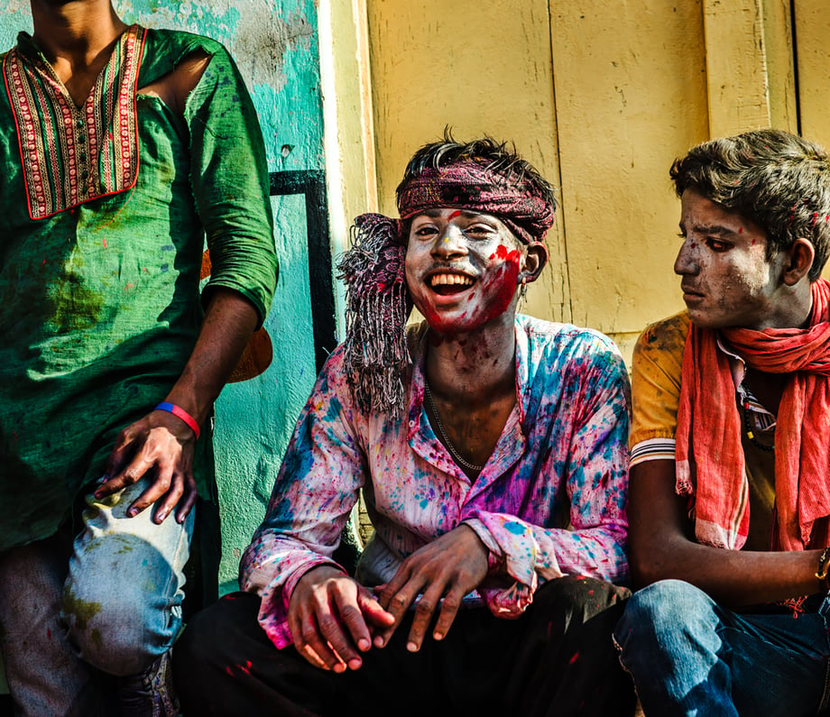Three men in left over paint from Holi festival shot by Michael Marquand for Lodestars Anthology