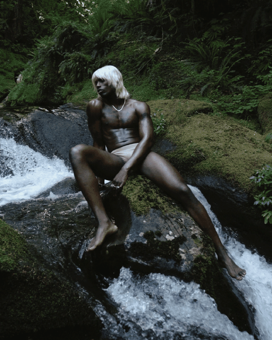 Gif of model sitting in waterfall shot by Molly Strohl for Shop Sounds