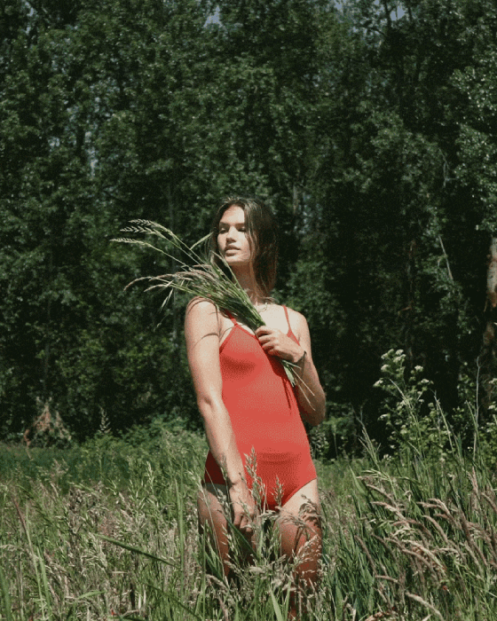 Gif of model in a grassy field shot by Molly Strohl for Shop Sounds