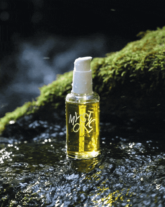 Gif of Shop Sounds body oil dripping in a waterfall shot by Molly Strohl