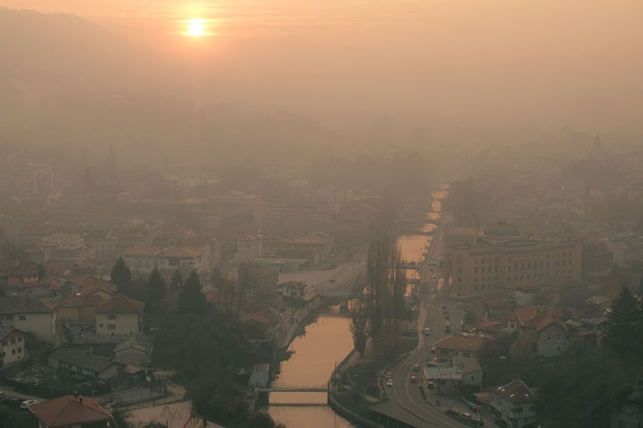 Smog hangs over Sarajevo on a heavily polluted winter day. The city’s geography, located in a basin surrounded on all sides by mountains that make up part of the Dinaric Alps, contributes to often lengthy periods of poor air quality during winter months.Photography by Nick St. Oegger. 