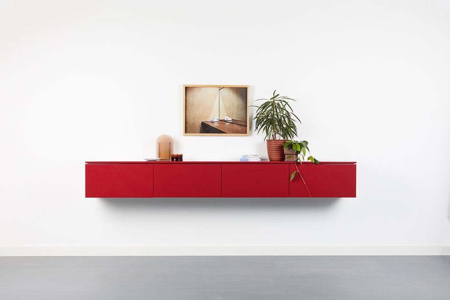 Deep red floating buffet made by Ensemble furniture shot by Peter Tarasiuk