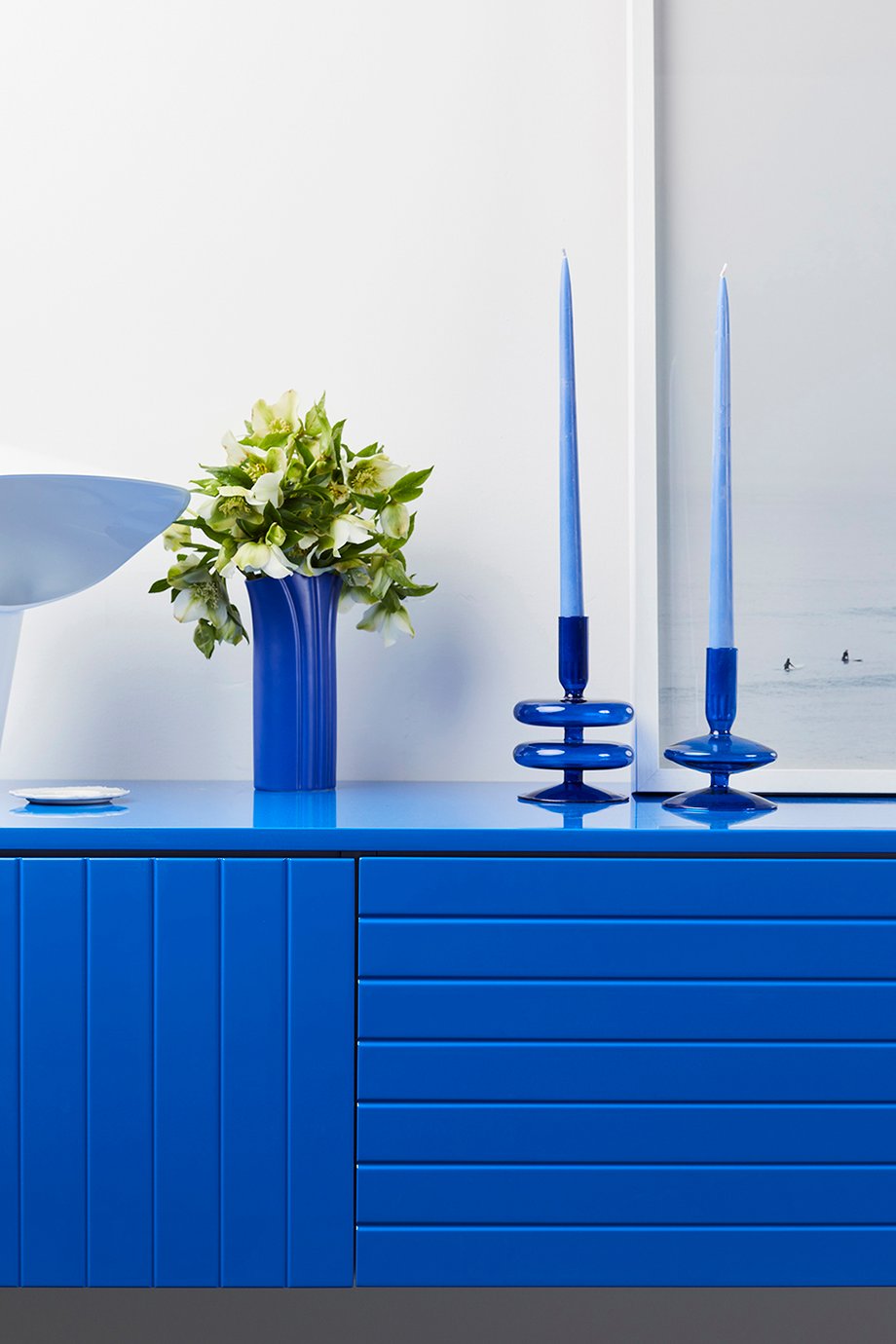 Bright blue floating buffet made by Ensemble furniture shot by Peter Tarasiuk