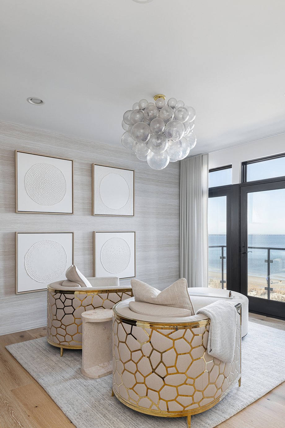 Bedroom chairs facing oceanside view in Virginia Beach home designed by Kenneth Byrd shot by Quentin Penn Hollar for Virginia Living Magazine
