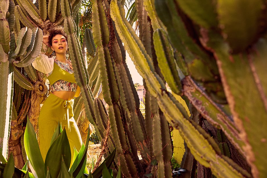 A model poses in a cactus garden.  Photographed by Sean Scheidt for Girls Life Magazine.