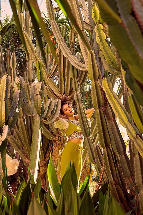 A model poses in a cactus garden.  Photographed by Sean Scheidt for Girls Life Magazine.