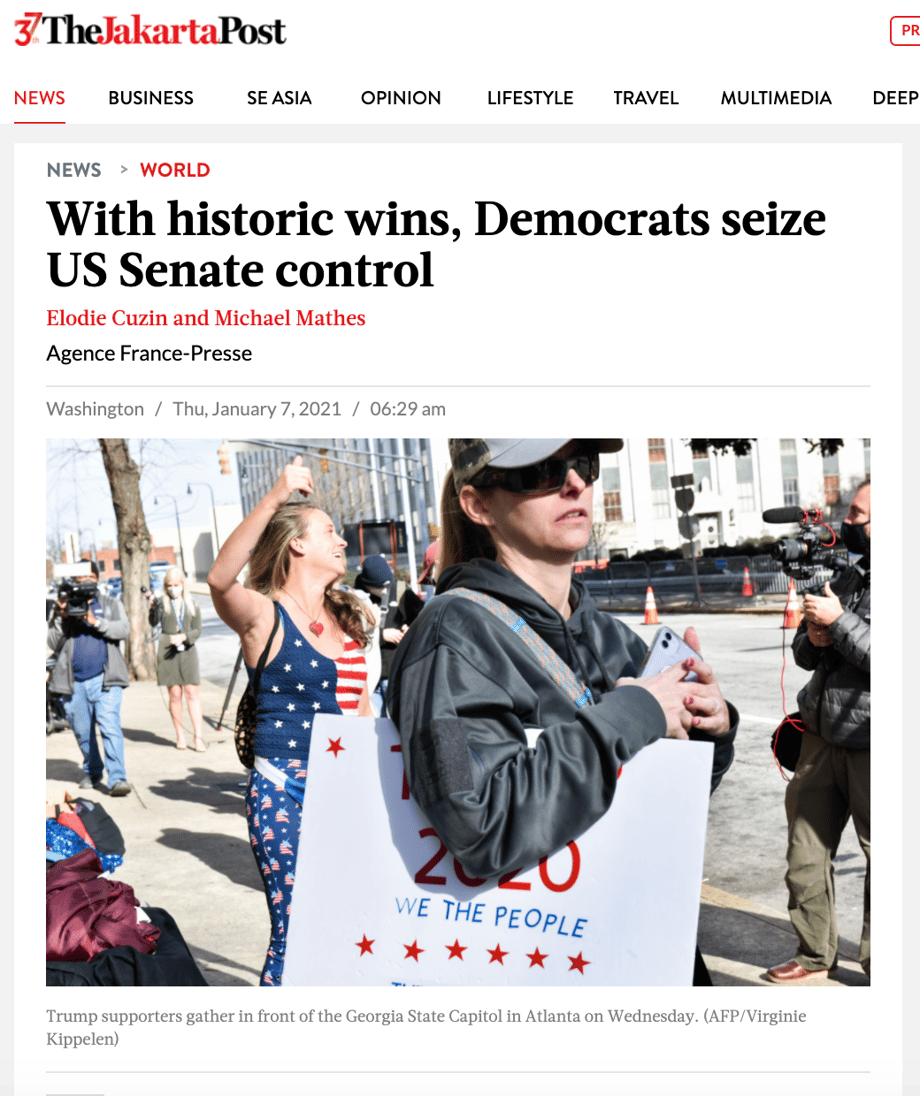 screenshot from The Jakarta Post for an article titled "with historic wins, democrats seize US senate control" paired with a portrait of protestors