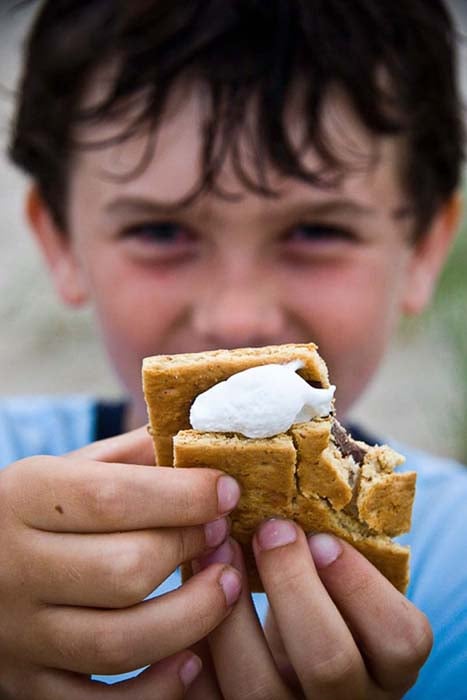 Porter Gifford (Boston, Massachusetts) photographed a boy with a s'more