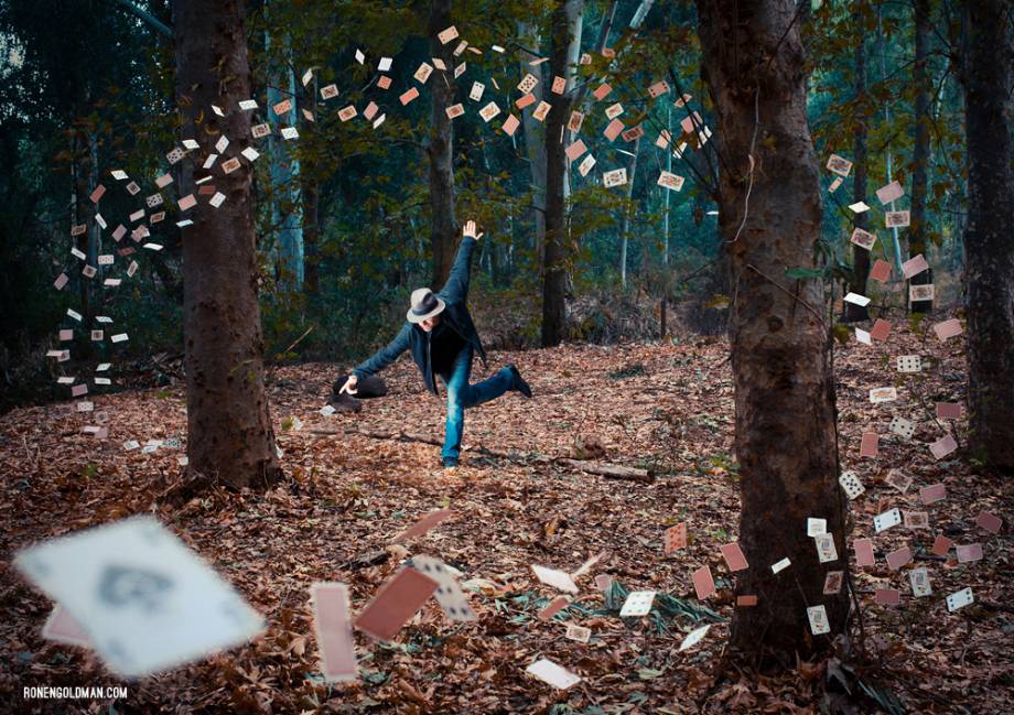 Man controlling flying cards shot by Tel Aviv, Israel-based conceptual photographer Ronen Goldman