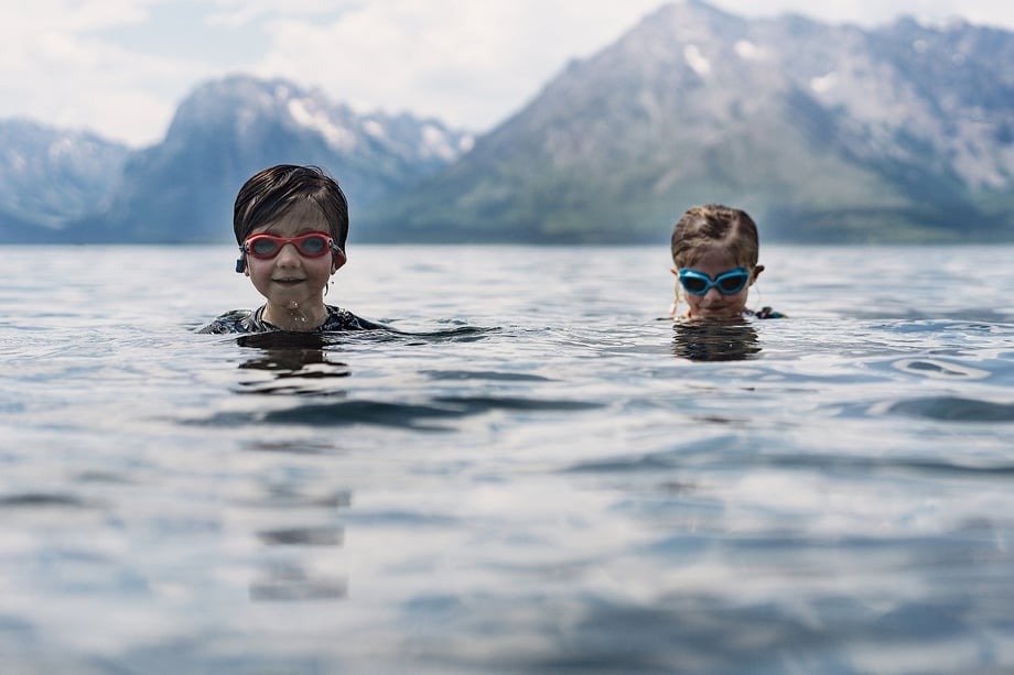 Photo of children in lake shot by Kat Schleicher