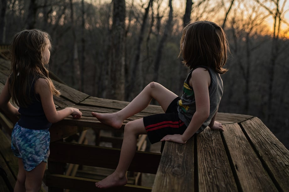 Photo of children in tree house shot by Kat Schleicher