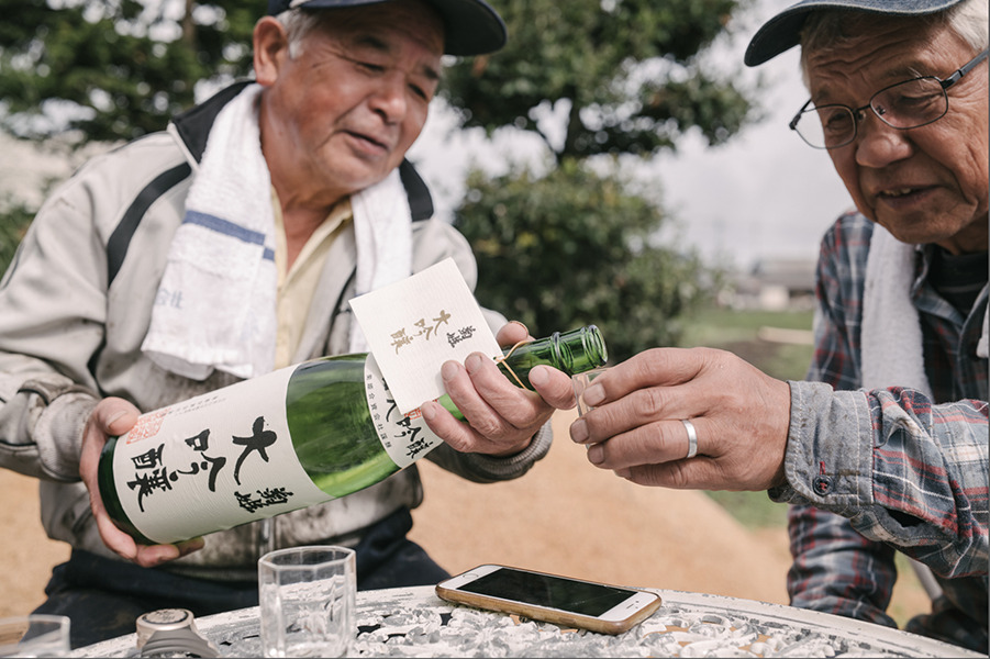 Two men trying Japanese Sake, image taken by Tokyo-based photographer Irwin Wong.