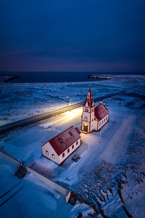 An aerial image of a church at night in Icealnd photographed by Bodega Bay, California-based Rachid Dahnoun.