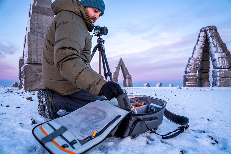 Photographer Rachid Dahnoun opens his Lowepro Flipside Photo Backpack at the Arctic Henge in Iceland.