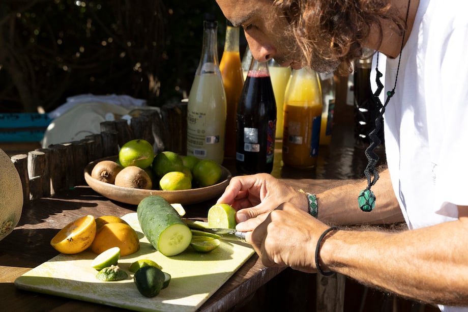 A Punta Caliza employee cuts fresh fruit and vegetables for guests, photographed by Chicago travel photographer Sandy Noto.
