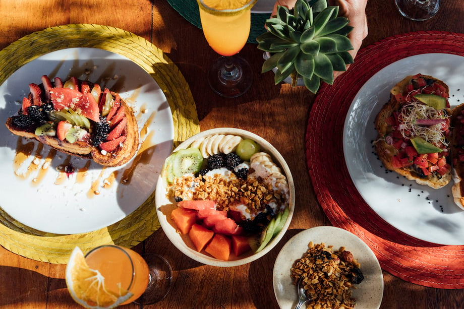 A spread of breakfast items at Punta Caliza hotel in Holbox, Mexico taken by Chicago-travel photographer Sandy Noto.